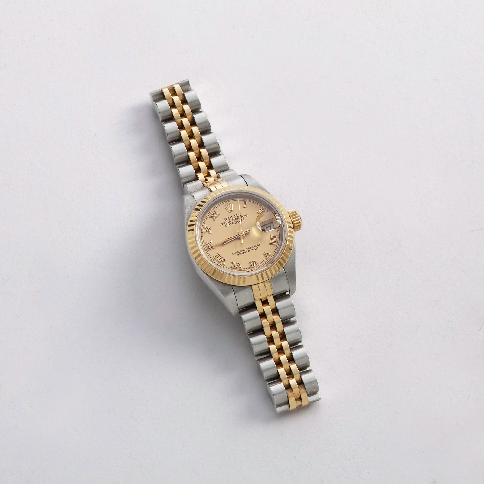 Rolex Oyster Perpetual Lady Datejust Watch: An authentic Rolex Oyster Perpetual Lady Datejust watch. Case #69173; Serial #W818xxx with champagne Roman dial, 18k yellow gold fluted bezel, two tone 18k gold and stainless steel bracelet 