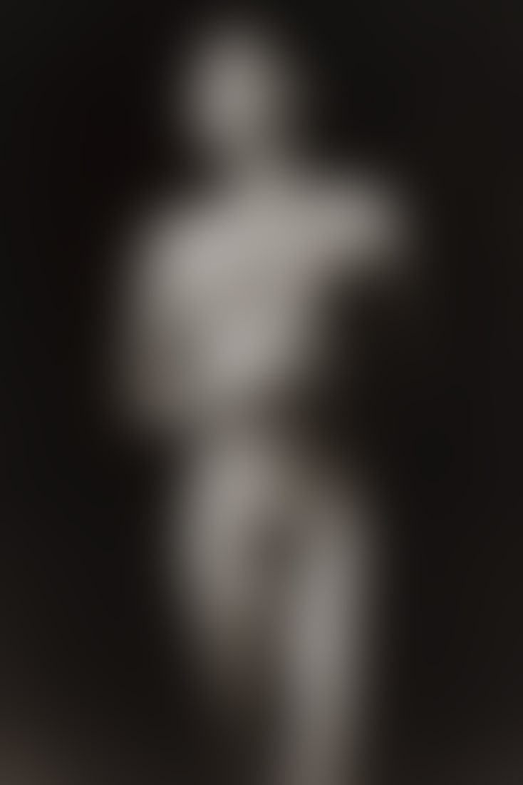 Joseph Caputo (American, 1955-1995): Untitled (Male Nude with Head Turned), 1991. Gelatin silver print. Photographer's stamp on the verso; Signed and dated in pen on the verso, "JCaputo; 1991". 10 x 8 in. (25 x