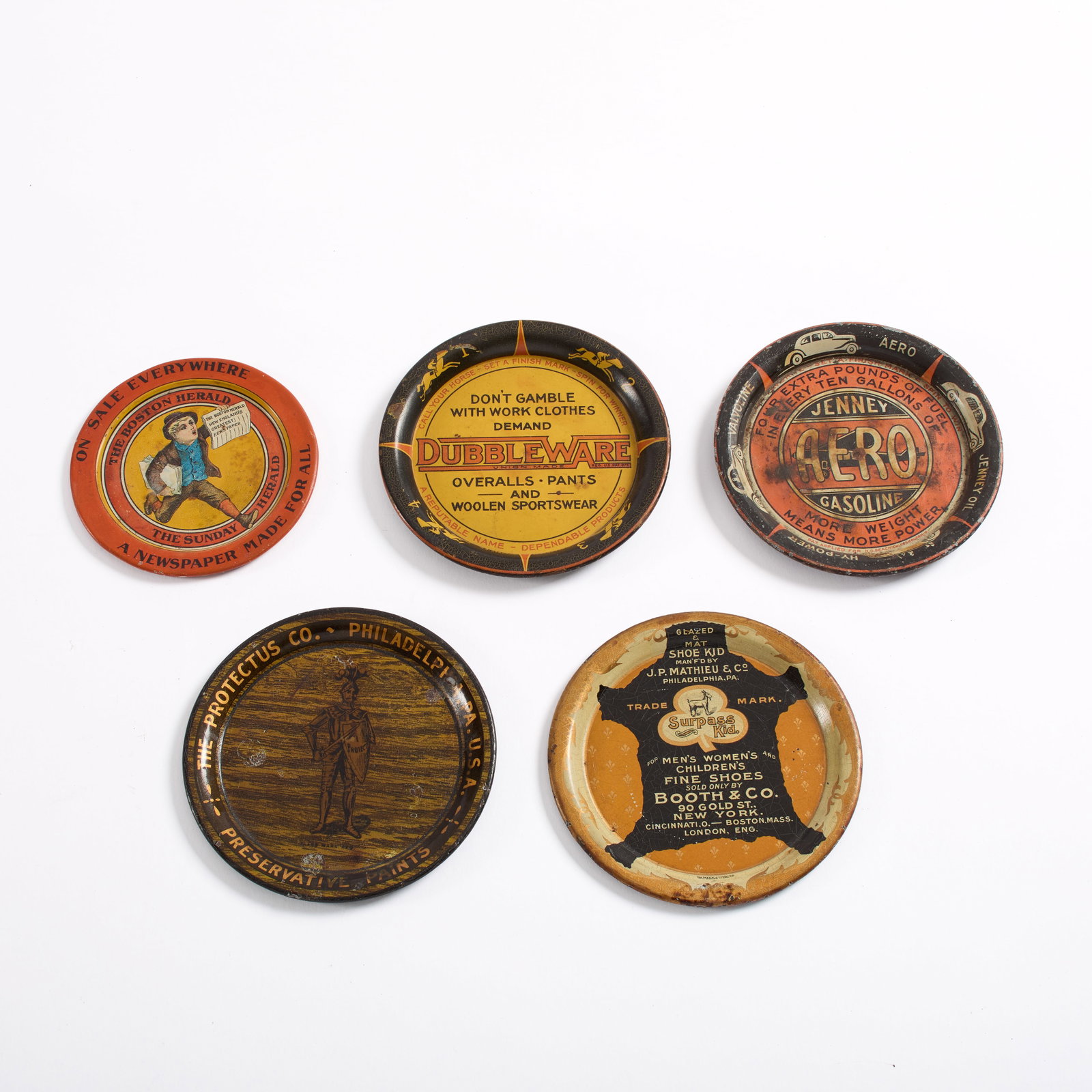 Collection of (5) Tin Lithographed Tip Trays: A collection of (5) tin lithographed tip trays. i. One (1) "Don't Gamble With Work Clothes Demand - Dubbleware - Union Made Overalls - Pants and Woolen Sportswear" tip tray. 4 1/4&