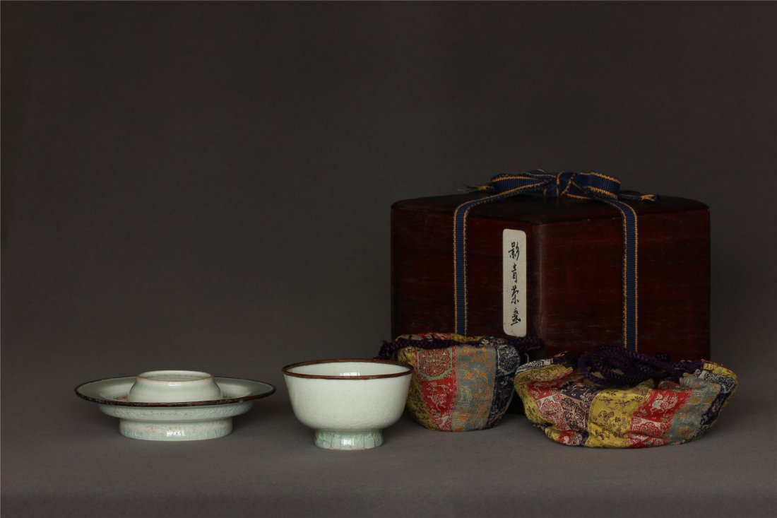 'HuTian' 'YingQing' Cup and Base Song Dynasty.: 'HuTian' 'YingQing' Cup and Base Song Dynasty. Contains box and bags. Cup Measure(inch), Height: 1-7/8, Diameter: 3-1/8 . Base Measure(inch), Height: 1-3/8, Diameter: 4-7/8 .
