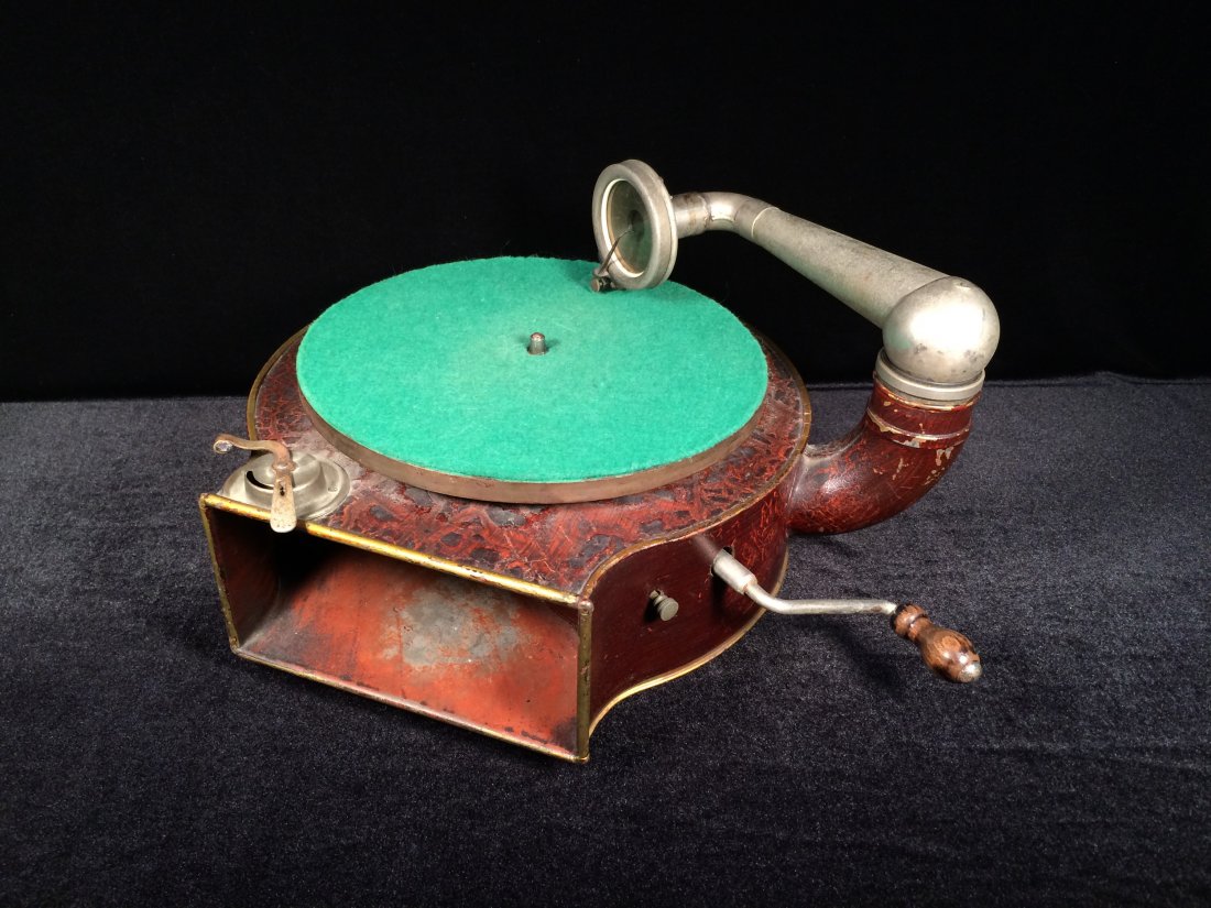 Antique metal case phonograph: Antique metal case the phonograph. Measure: 7" Height, 10 1/2" Diameter