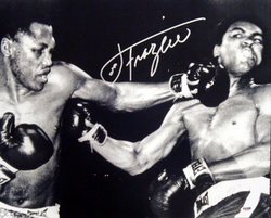 Joe Frazier Boxing Hand Signed 16x20 Photograph vs Muha: Joe Frazier known as Smokin' Joe, was an American professional boxer, Olympic gold medalist and Undisputed World Heavyweight Champion, whose professional career lasted from 1965 to 1976, with a one-fi