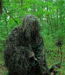 Synthetic Ultra-Light Ghillie Bow Hunting Jacket Right : We use Industrial sewing machines to sew a knotted 1" x 1" nylon netting directly to a Military BDU 4 pocket coat. These jackets are made by "ATLANCO". Our Synthetic thread is directly hand tied to th