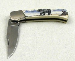 Scrimshaw by Sabre Bear Pocket Knife: Scrimshaw by Sabre Bear Pocket KnifeMeasures: Stainless steel locking blade. Cabin scene on one side, Bears on the other. 4" X 1 1/4" X 1/2" With open blade 7 1/4"