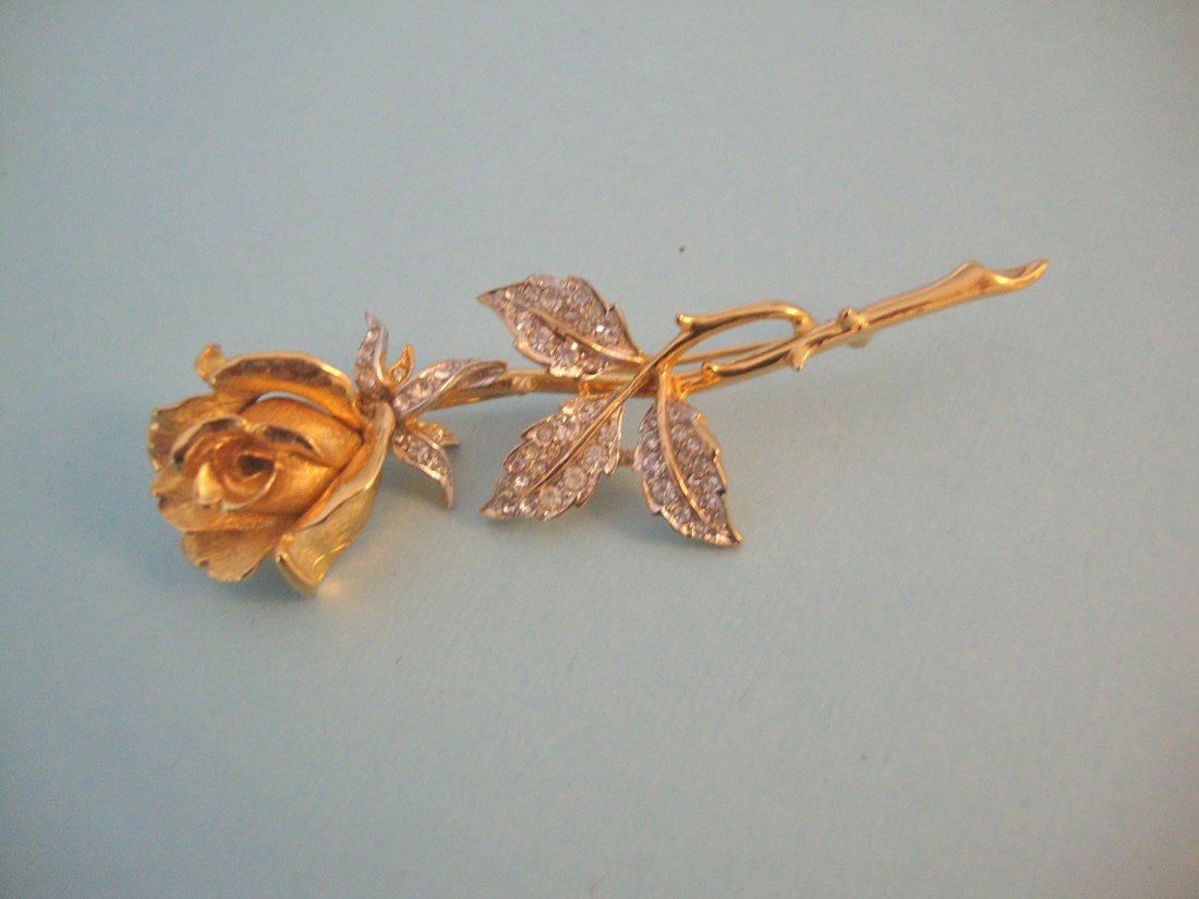 Marcel Boucher vintage rhinestone brooch....gorgeous go: marcel boucher vintage rhinestone brooch....gorgeous gold tone and rhinestone flower brooch.;perfection. signed and numbered this beautiful brooch has the 'boucher' hallmark on the back....a delicate 
