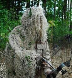 Synthetic Ultra-Light Ghillie Bow Hunting Jacket Left H: We use Industrial sewing machines to sew a knotted 1" x 1" nylon netting directly to a Military BDU 4 pocket coat. These jackets are made by "ATLANCO". Our Synthetic thread is directly hand tied to th