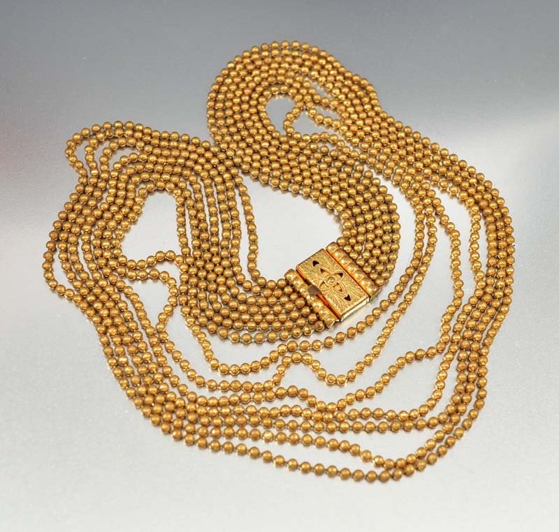 Smashing late 1930s Art Deco multi strand necklace with: smashing late 1930s art deco multi strand necklace with seven (7) strands of gold gilt brass ball bead chains! the chains have round beads and are gathered with a decorative slide clasp. wear the clas