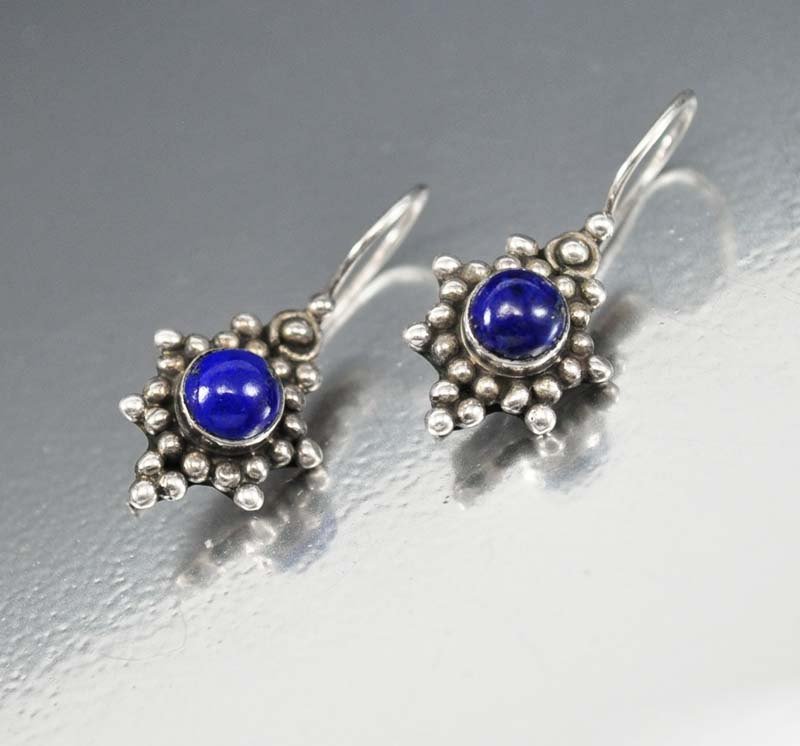 Deep cobalt blue lapis lazuli cabs are the focal point : deep cobalt blue lapis lazuli cabs are the focal point in these vintage dangle earrings! each lapis stone is band wrapped and set in a sterling silver frame of beads and suspended from shepherd hook w