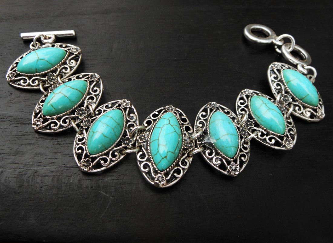 Beautiful and elegant turquoise bracelet at a good valu: beautiful and elegant turquoise bracelet at a good value.;we collected this turquoise bracelet while traveling through tibet and western china. it features 7 linked pieces with professionally set turq