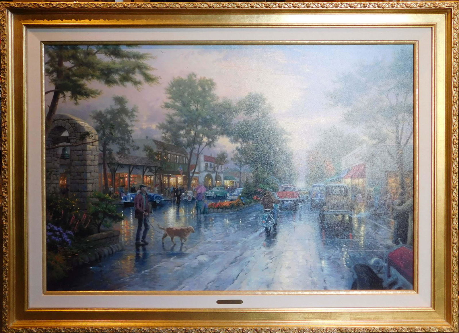 Thomas Kinkade: Carmel, Sunset on Ocean Avenue: Thomas Kinkade (American, 1958-2012): Carmel, Sunset on Ocean Avenue. Limited Edition lithograph on canvas with hand painted highlights added by a Thomas Kinkade Master Apprentice. Artist's copyright