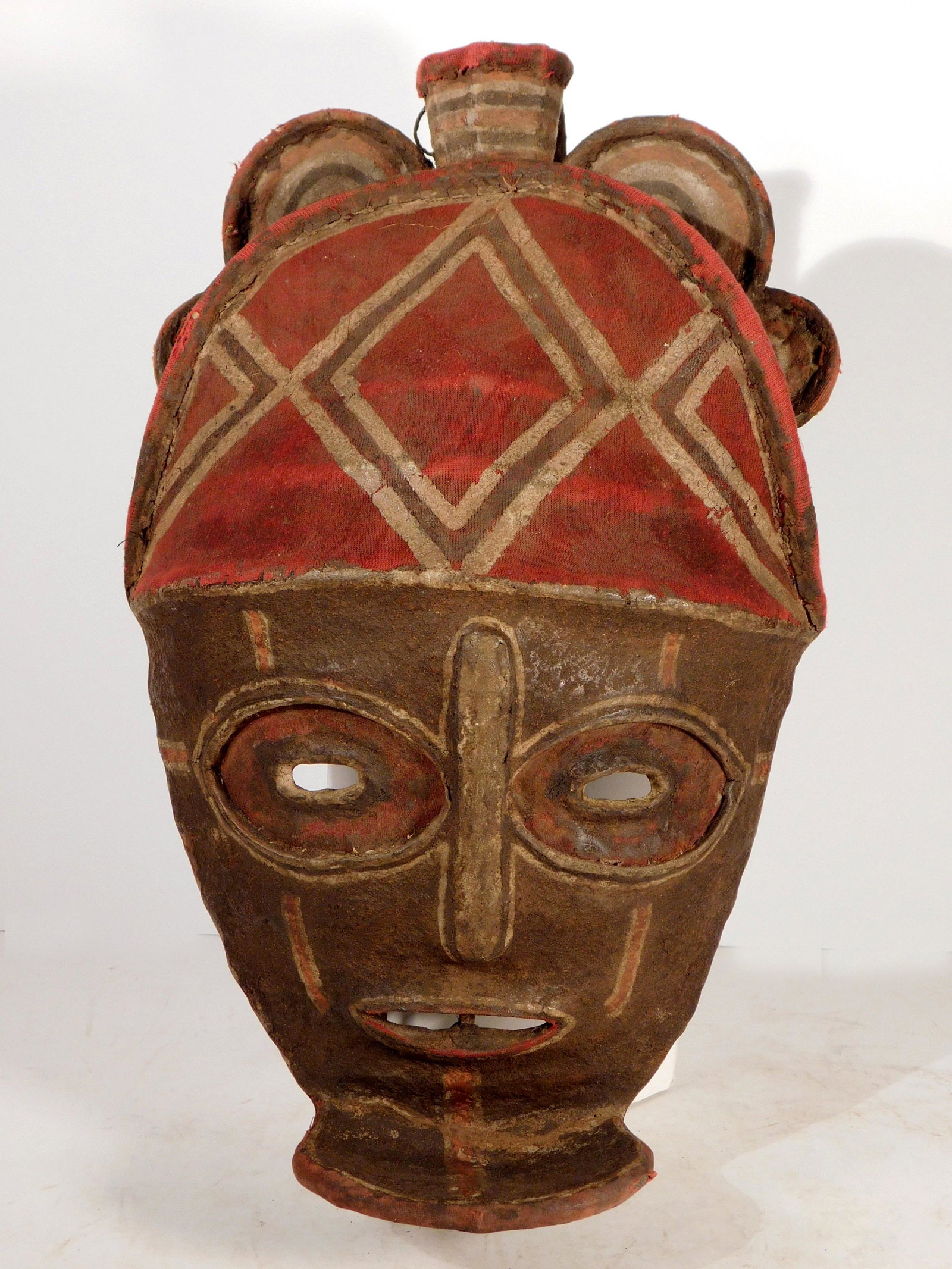 Mask, Pende People, Zaire, Cloth and Wood: Pende People, Zaire, Mask made of cloth stretched over an armature of bent wooden strips. The face area is painted in abstract designs which emphasize the eyes. At the chin there is a stylized beard w