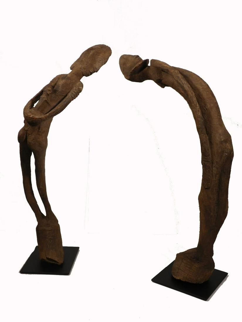 African Tribal Art "Leaning" Figures: Dogon People, Mali. Gracefully leaning couple, male and female. The Female carries a baby on her back. The Dogon say that the figures were magically seen in trees by Spiritual Leaders and described to