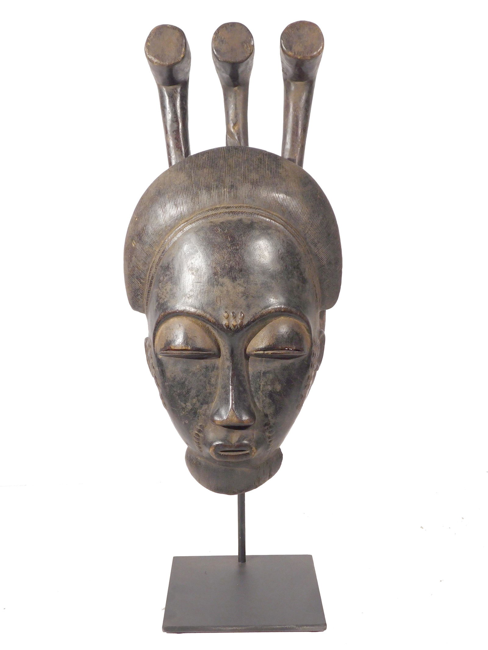 Portrait Mask, Baule People, CÃ´te d'Ivoire: Baule People, CÃ´te d'Ivoire: Portrait Mask (Mblo), finely carved and finished wood with a dark patina. The face features beautiful scarification marks between the brows, at the corners of the mouth