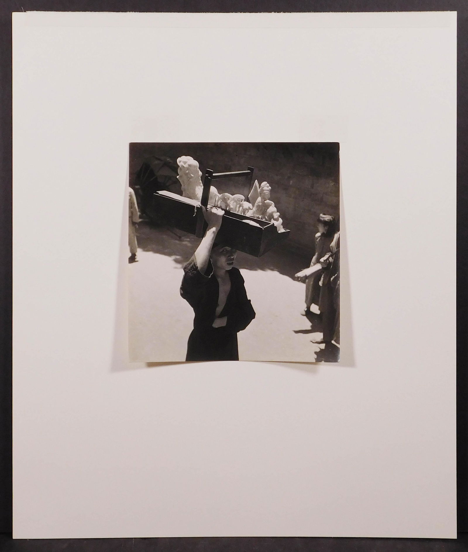 Cecil Beaton: Chinese Sweetseller with Sugar: Cecil Beaton (British, 1904-1980): Chinese Sweetseller with Sugar Sculptures, 1945. Vintage gelatin silver print. Photographed in Chengtu, Sze-chwan, China. Hinged to mat board. Labeled British Offici