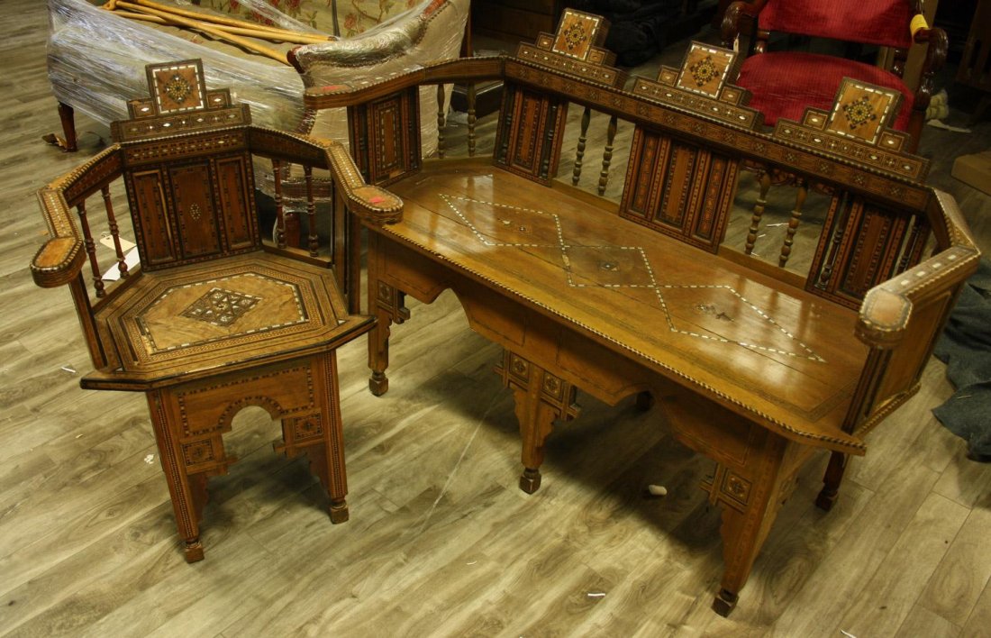 AN INLAID EXOTIC-WOOD NEAR EASTERN SETTEE,: AN INLAID EXOTIC-WOOD NEAR EASTERN SETTEE A very rare late 19th - early 20th century Near Eastern exotic-wood and parquetry inlaid settee, having a crest-rail adorned with three pyramidal apexes, each