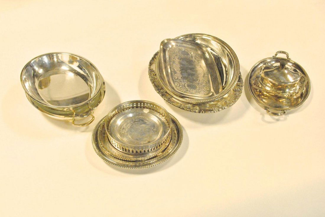 A collection of eleven silverplate items including coas: A collection of eleven silverplate items including coasters, plates, dishes and one glass insert.Estimate $60/70