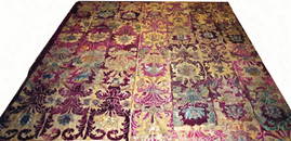 AN ITALIAN VELVET AND SILK NEEDLEPOINT CURTAIN,