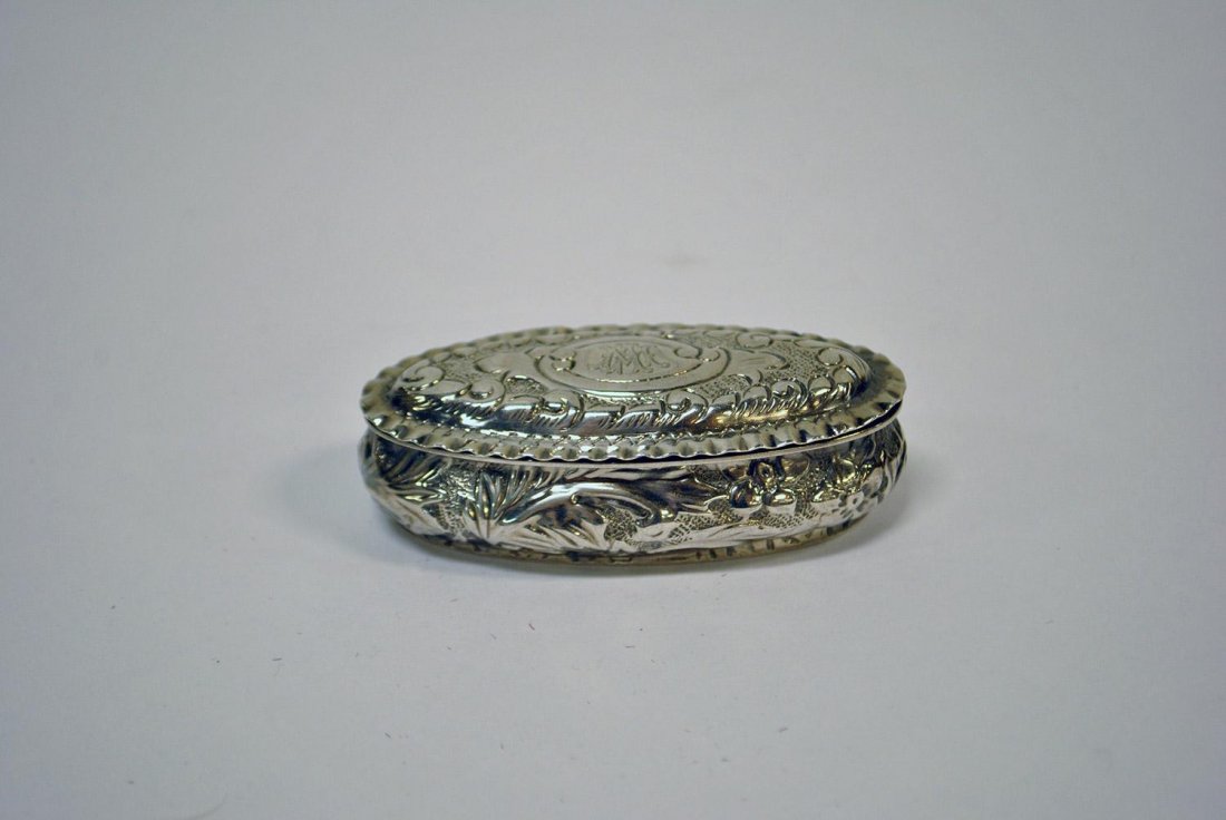 A SMALL BIRKS STERLING SILVER SNUFF BOX WITH CARVED FL