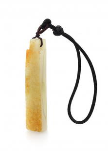 A TUBULAR MILKY GREEN JADE CARVING, 19TH CENTURY,: A TUBULAR MILKY GREEN JADE CARVING19TH CENTURY十九世紀 白玉菱管in an arch shape with a long and tubular milky green jade carving with a rounded front an