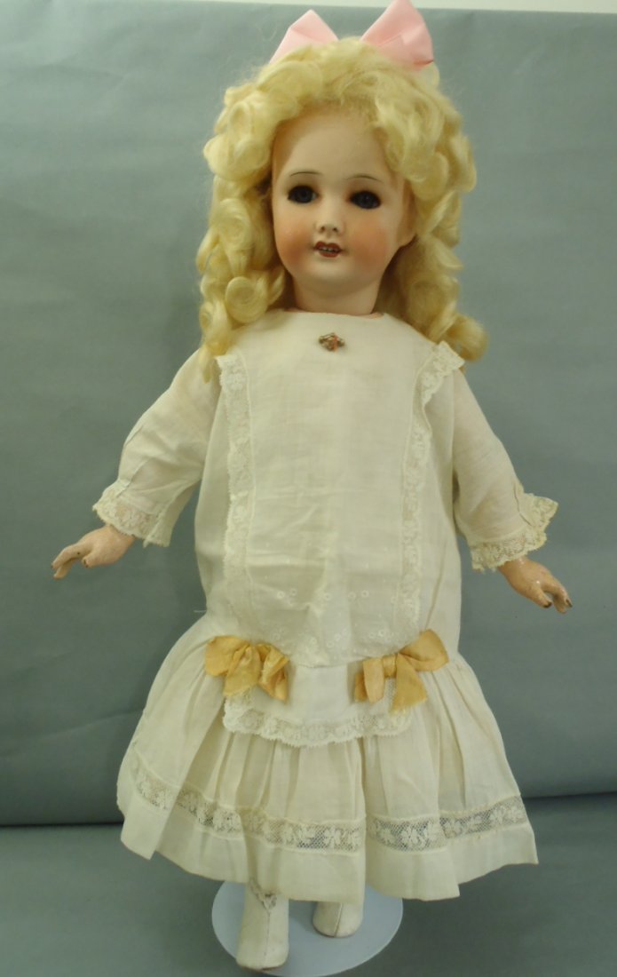 Unis France Jumeau walking and kiss throwing Doll 22"T: French Bisque Unis France on walking and kiss throwing body with working crier. Unis France Doll is one of the last of the dolls made under the name Jumeau. She has high colored bisque with open moth 