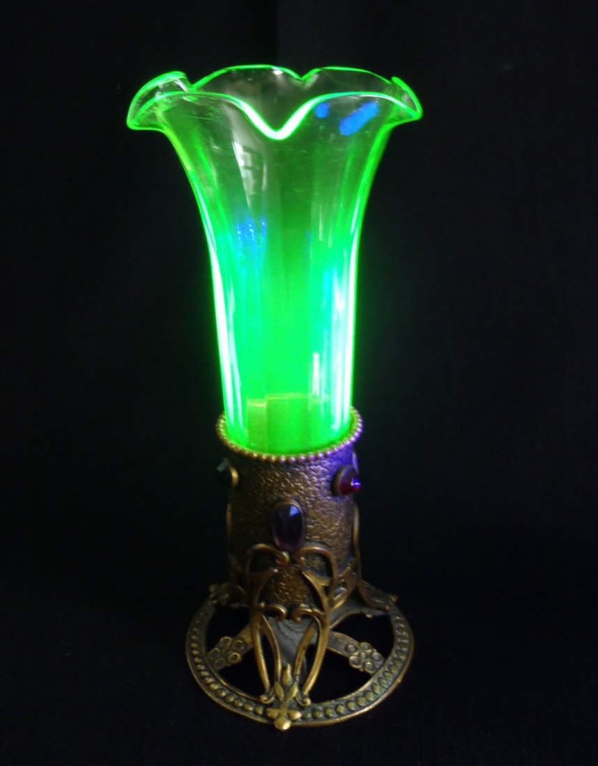 Art Nouveau Vaseline/uranium glass Epergne w/Jewels: This is very decorative Epergne/Trumpet vase with brass base adorned with colorful jewels in typical Art Nouveau fluid design with gorgeous Vaseline glass insertCondition: good condition with no break