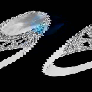 6.39 Ctw VS/SI1 Rainbow Moonstone And Diamond 14K White Gold Engagement Rin: Center Stone Weight : 5.30 Ctw ( Oval Cab ) Center Stone Color : Rainbow Moonstone Stone Setting : Prong Side Diamond Weight Of Ctw 1.09 Ctw Side Stone Color : J-K Stone Clarity : VS/SI1 Stone Setting