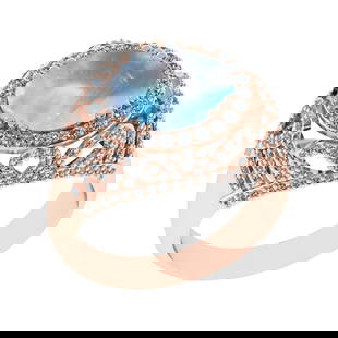 6.39 Ctw I2/I3 Rainbow Moonstone And Diamond 10K Rose Gold Engagement Ring(: Center Stone Weight : 5.30 Ctw ( Oval Cab ) Center Stone Color : Rainbow Moonstone Stone Setting : Prong Side Diamond Weight Of Ctw 1.09 Ctw Side Stone Color : J-K Stone Clarity : I2/I3 Stone Setting