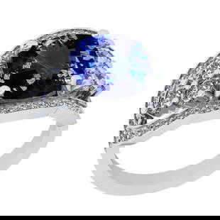6.51 Ctw VS/SI1 Tanzanite And Diamond 18k White Gold Cocktail Ring: Center Stone Weight : 5.09 Ctw (Cushion Cut ) Center Stone Color : Tanzanite Stone Setting : Prong Side Stone Weight Of Ctw 1.42 Ctw Side Stone Color : J-K Stone Clarity : VS/SI1 Stone Setting : Prong