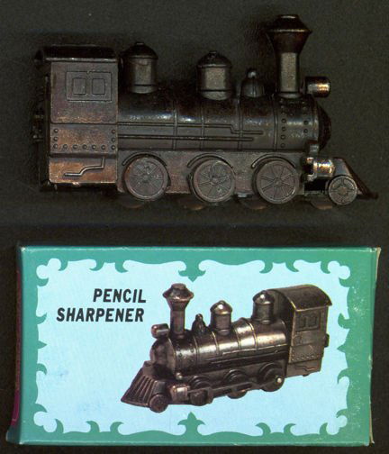Die-Cast Heavy Metal Locomotive Diecast Pencil Sharpene: Die-Cast Heavy Metal Locomotive Diecast Pencil Sharpene **|**|** Vintage 3 1/2" wide die cast heavy metal pencil sharpener in the original illustrated box. These are the old 1960/70s type. The wheels
