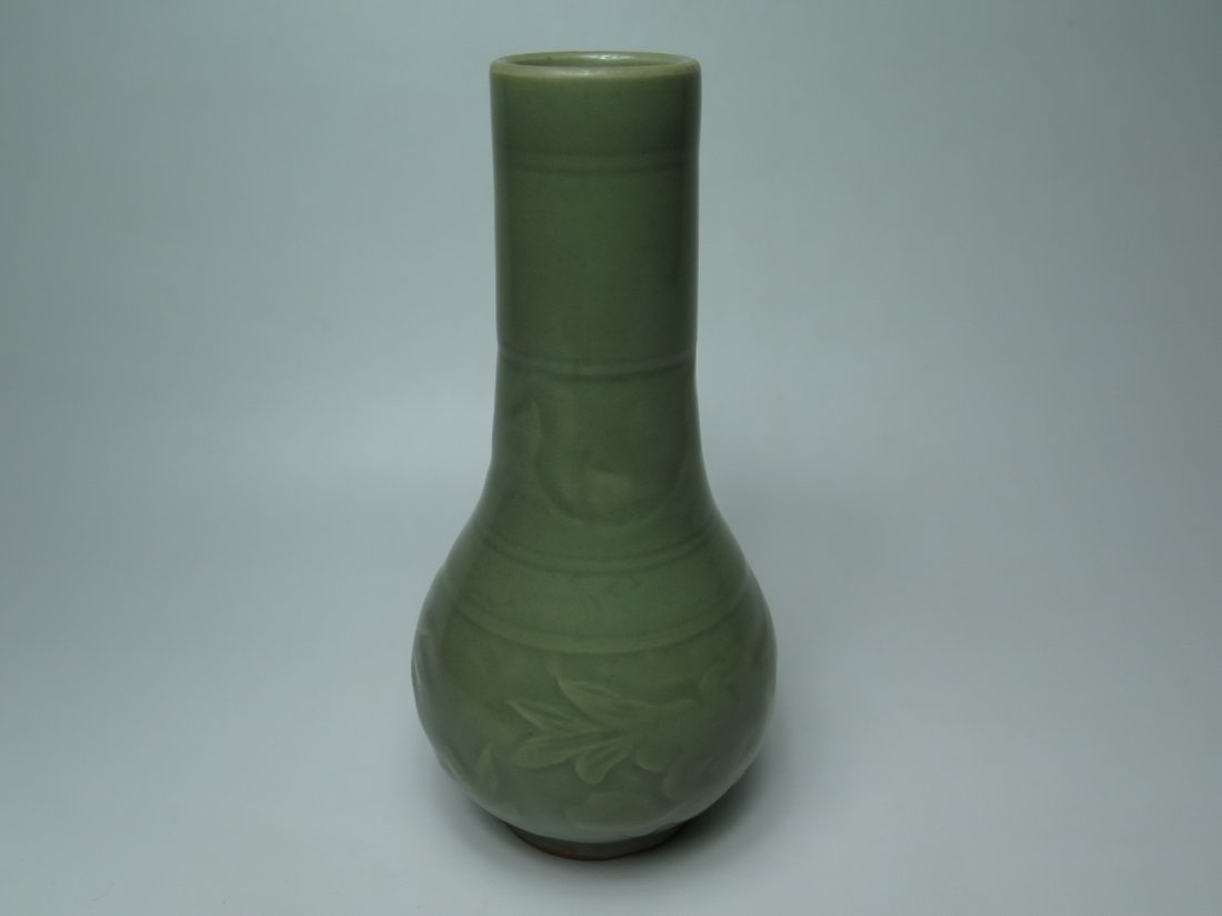 A Celadon-Glazed Vase: Ming Dynasty celadon-glazed vase. Light green-glazed color tone overall. H:21.5cm.
