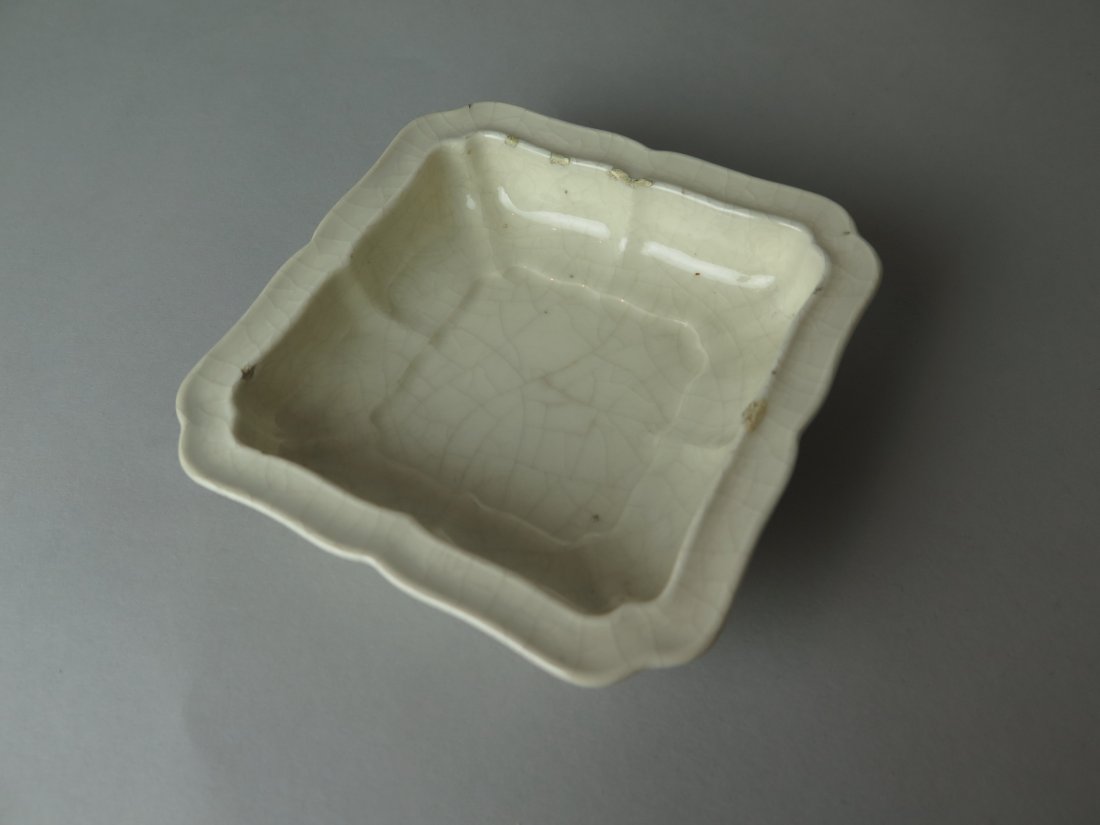 Chinese Crackle White Glazed Wash: Qing Dynasty Chinese crackle white glazed washer/dish with carved inscription of a poem within base square panel. Size: 10.4cm x 10.4cm.