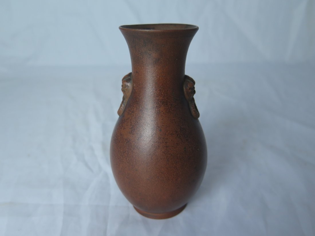 Chinese Yixing Zisha Vase: Qing Dynasty Chinese Yixing Zisha vase, flanked by two lion mask handles. H:12.5 cm.