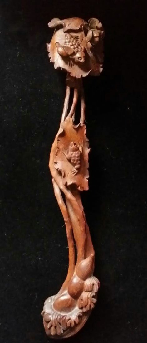 A Chinese Chenxiang Wood Ruyi (1 of 4)