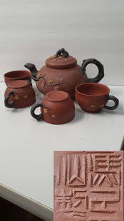 old. Purple clay teapot.: old. Purple clay teapot.Wooden pallets not included