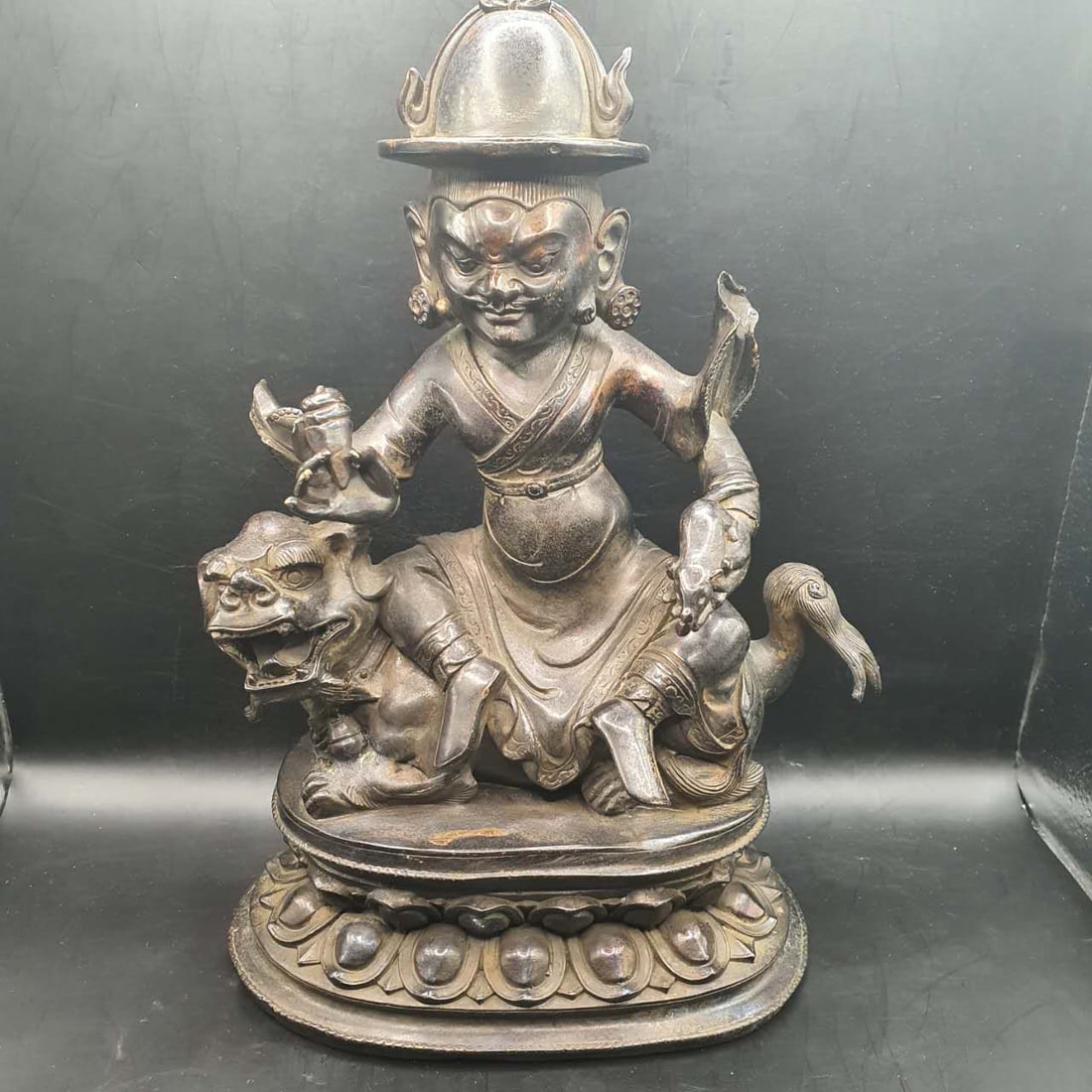 An old bronze statue of the God of Wealth, with traces of gilding. (1 of 8)