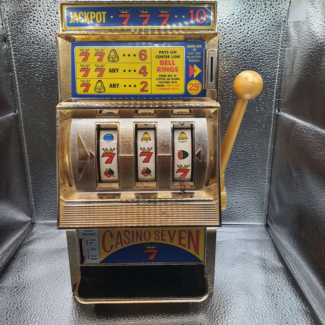 This is a 1970 vintage "Casino Seven" mechanical slot machine toy piggy bank manufactured by Waco in (1 of 4)