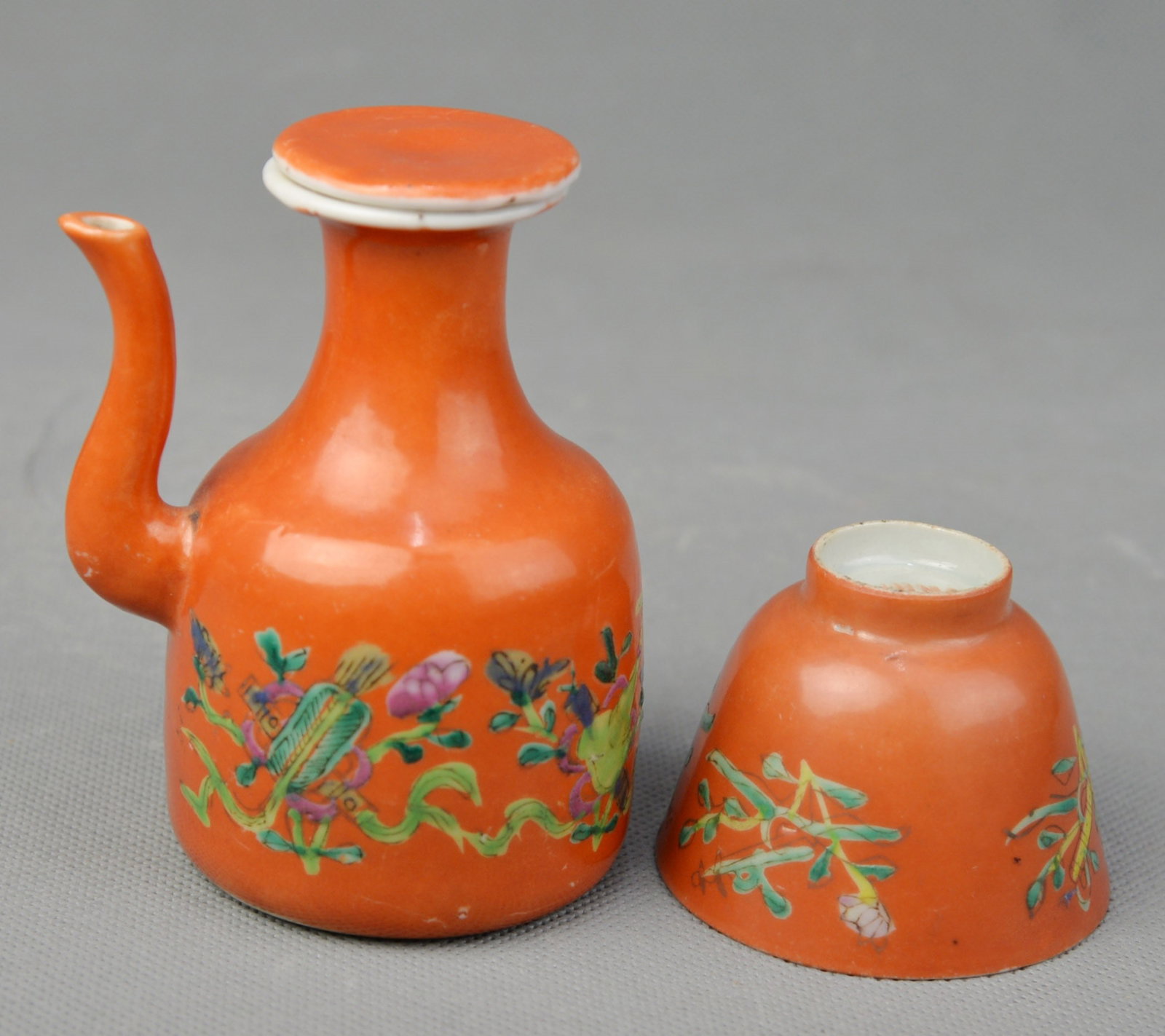 A Coral Red Famille Rose Teapot: A Coral Red Famille Rose Teapot of Ba Bao Pattern Marked Tongzhi Period, Qing Dynasty, H 4 1/2"