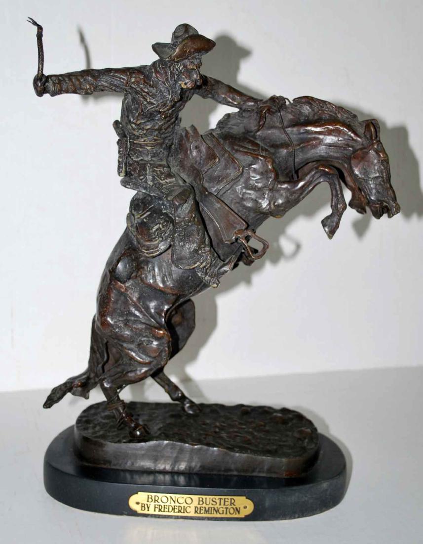 After Frederic Remington Bronco Buster Bronze: 13" tall(14" with base)10 1/2" x 5.5",