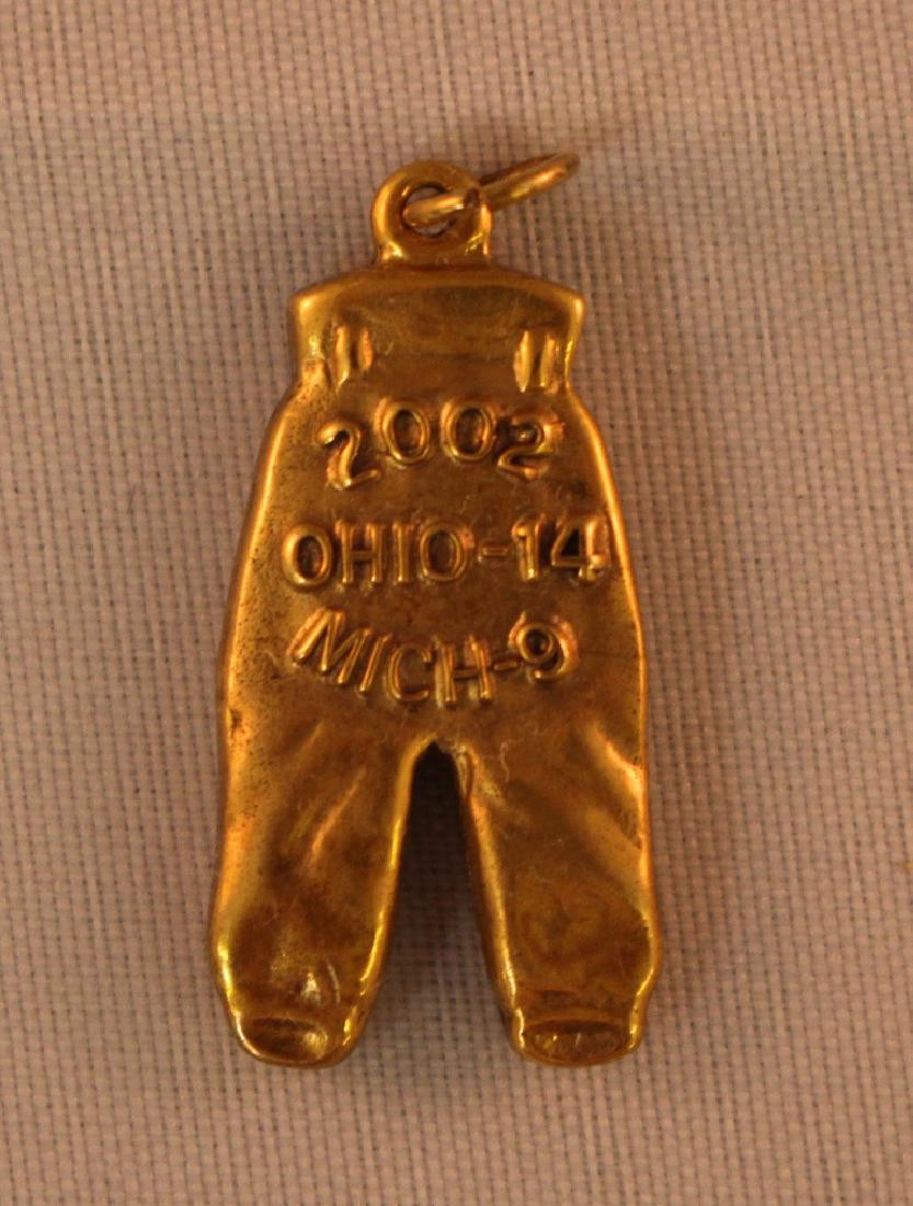 2002 Ohio State Gold Pants: 2002 Ohio State Gold Pants in NRMT condition. Ohio State 14, Michigan 9. Suggested bid $2500