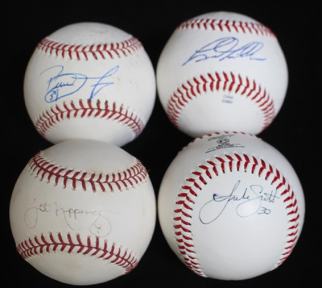 (4)Houston Astros players autographed baseballs: Group of 4 single signed baseballs of Houston Astros players incl. Brad Mills on a OML Pat O'Conner baseball, then three on OAL Bud Selig balls incl. Brett Myers, Jeff Kippinger (faded) and Luke Scott