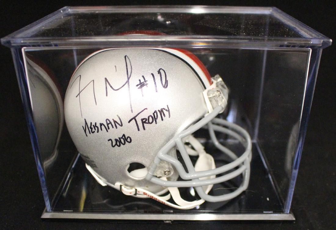 Troy Smith Heisman 2006 signed OSU mini-helmet: Troy Smith Heisman 2006 signed OSU mini-helmet in black fine point sharpie with full "Heisman Trophy 2006" inscription. Troy James Smith (born July 20, 1984) is an American former gridiron football qu