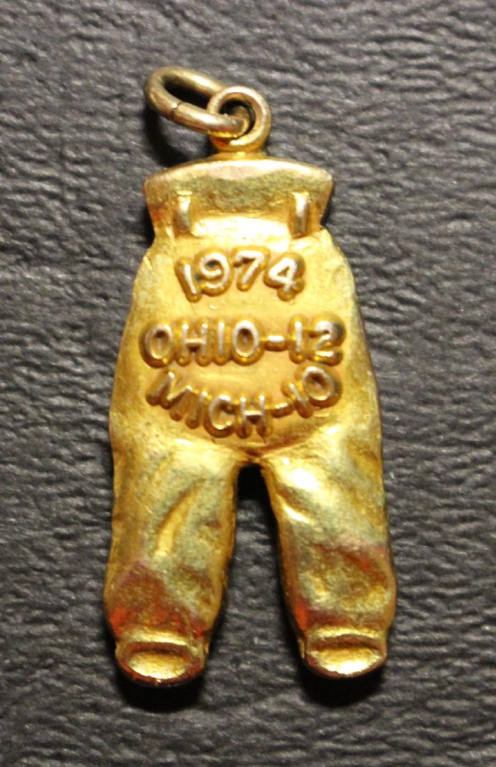 1974 Ohio State Buckeyes Gold Pants: 1974 Ohio State Buckeyes Gold Pants in EXMT condition. Indistinct player initials. The Buckeyes beat Michigan 12-10 that year. Suggested bid $1500