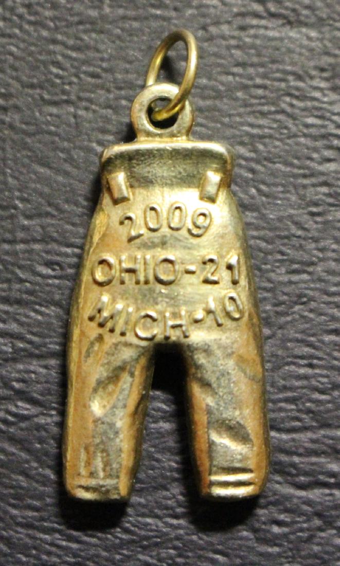 2009 Ohis State Buckeyes Gold Pants: 2009 Ohio State Buckeyes Gold Pants in MINT condition. Initials are DP. Devier Posey or Dan Potokar. The Buckeyes beat Michigan 21-10 that year. Suggested bid $2000