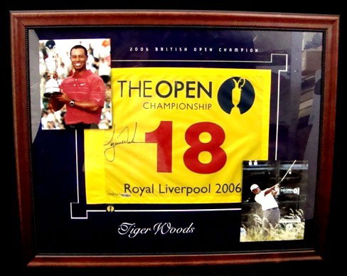 Tiger Woods Signed 2006 British Open Pin Flag, UDA,: Tiger Woods Autographed 2006 British Open Royal Liverpool Pin Flag; signed in black sharpie marker; limited edition #106 out of 500 made; yellow flag with black matting measuring 32" x 25"; Upper Deck
