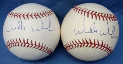 Pair of Willie Wilson Autographed Baseballs: Lot of (2) Official MLB Bud Selig Baseballs signed by Wilson on the sweet spot in blue ink; nice, clean signatures; signed at the Negro League Baseball Museum Legacy Awards Ceremony on 1-13-07; lot co