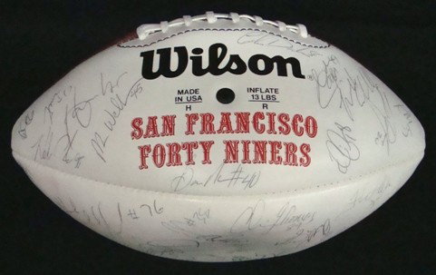1995 San Francisco 49ers Signed Team Ball: San Francisco 49ers Autographed Wilson Official NFL Football signed by members of the 95 team; signatures include Chris Thomas, Tim Harris, Brian O'Neal, Antonio Goss, Anthony Lynn, Gary Plummer, Dere