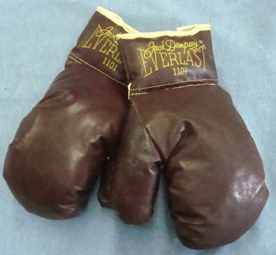 Pair of Jack Dempsey Model Kid Gloves: Pair of Jack Dempsey Model #1101 Everlast Youth Boxing Gloves; NM condition; brown gloves with white trim and yellow lettering; includes facsimile signature; lace up backsides; all original.