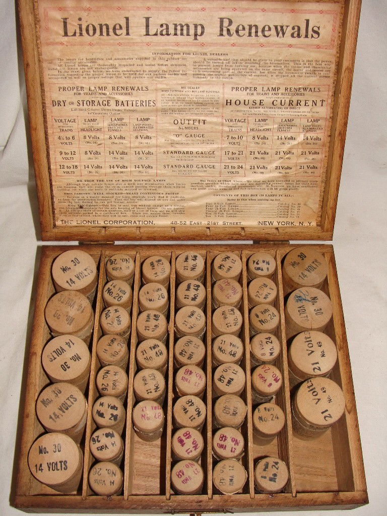 Pre-War Lionel Lamp Renewals Dealers Box Kit: Pre-War Lionel Dealers Lamp Replacement Kit with wood light protectors. Kit contains 46 of 50 original holders, many with labels still attached, only one bulb is present. Contains Seven No. 30 - 14 Vo
