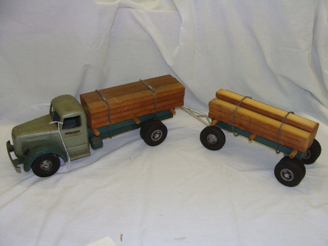 L.Mack Smith Miller Lumber Truck: Pressed steel truck in excellent condition with slide off lumber load. Nearly all original paint. Just needs a good cleaning.