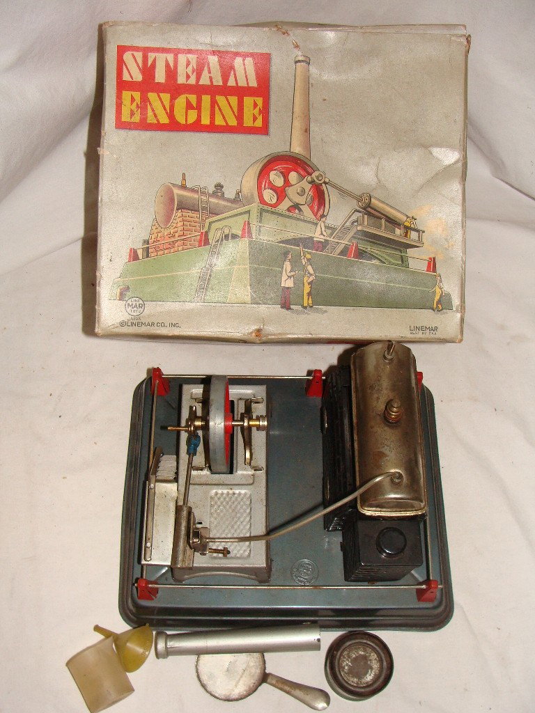 LINEMAR Steam Engine with Original Box: Toy appears to be complete, spring is still in the piston, the tank has been damaged, box is soiled, with some frayed edges, all staples are intact with no rips. Please view the pictures to see whethe